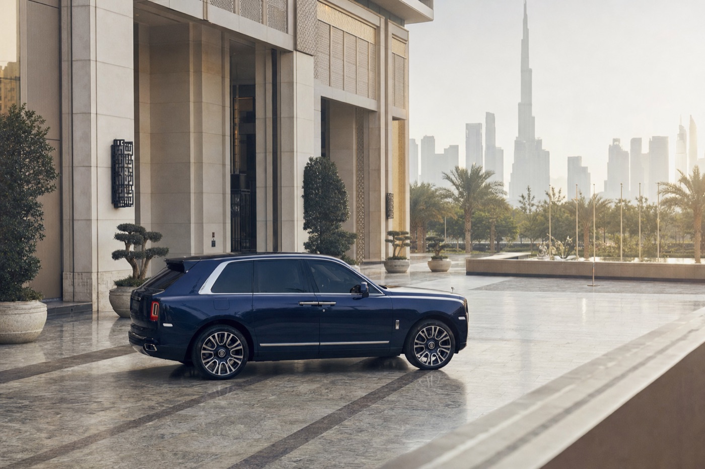 Supercar hire in Dubai with hotel delivery: a Rolls-Royce Cullinan stopped at a luxury hotel entrance