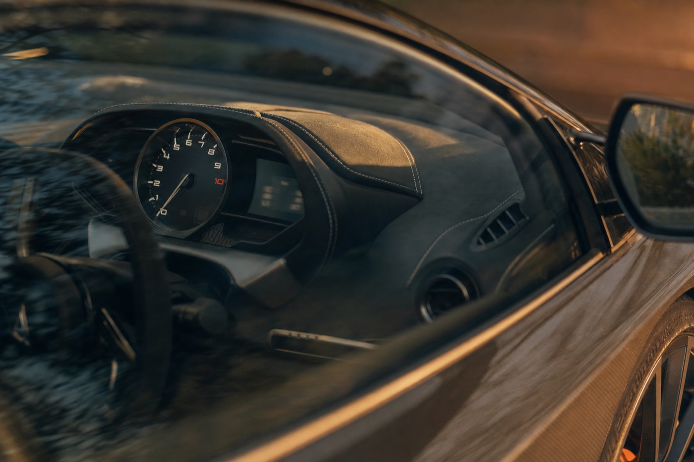 Compare deposits, mileage and taxes before the daily rate: the instrument cluster of a supercar with the odometer in soft focus